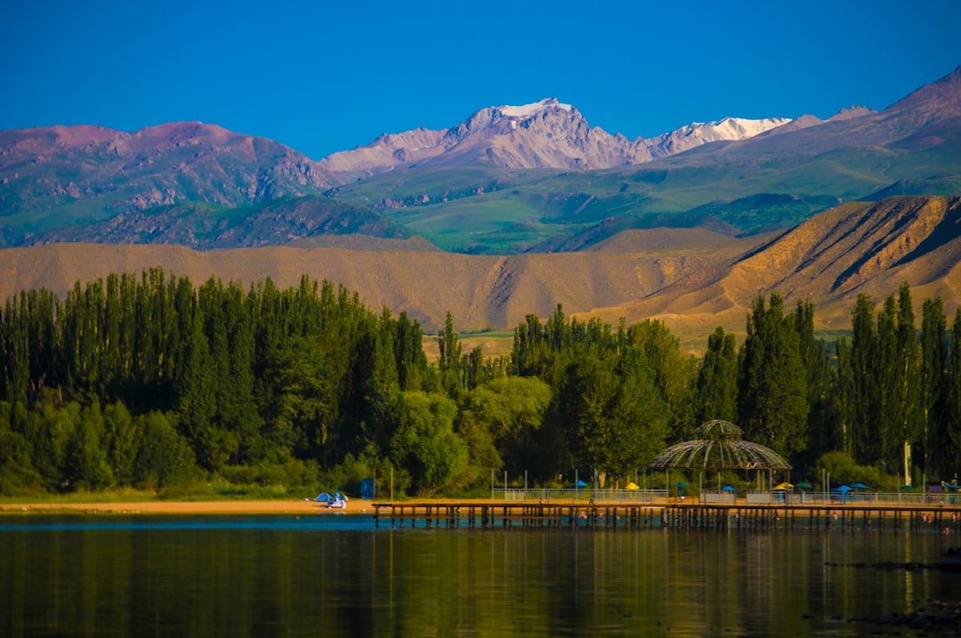 a lake with mountains in the background