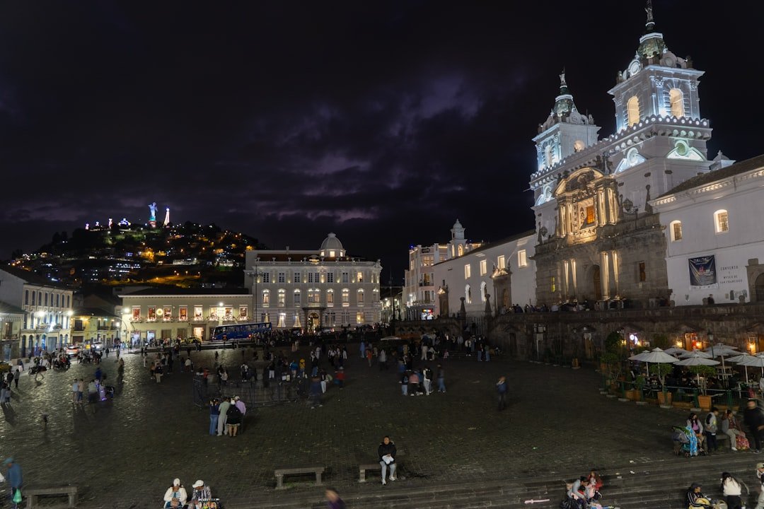 City square with illuminated buildings at night