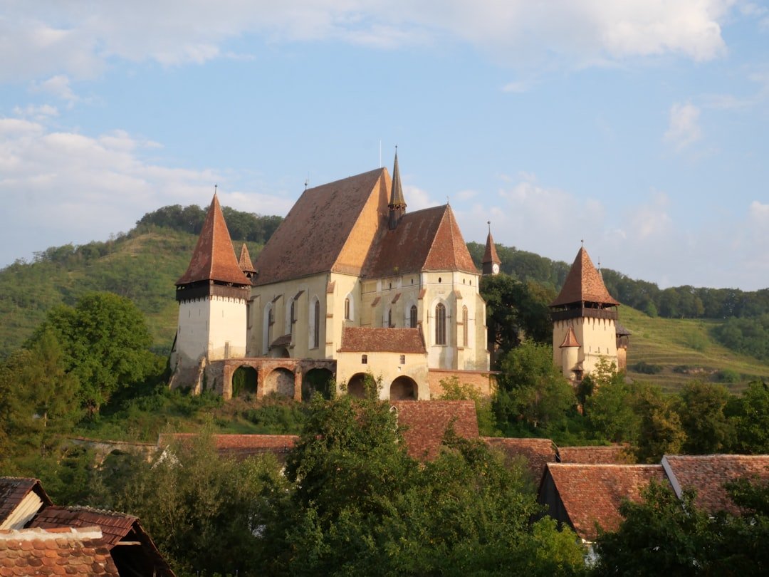 Fortified church on a hill under blue sky