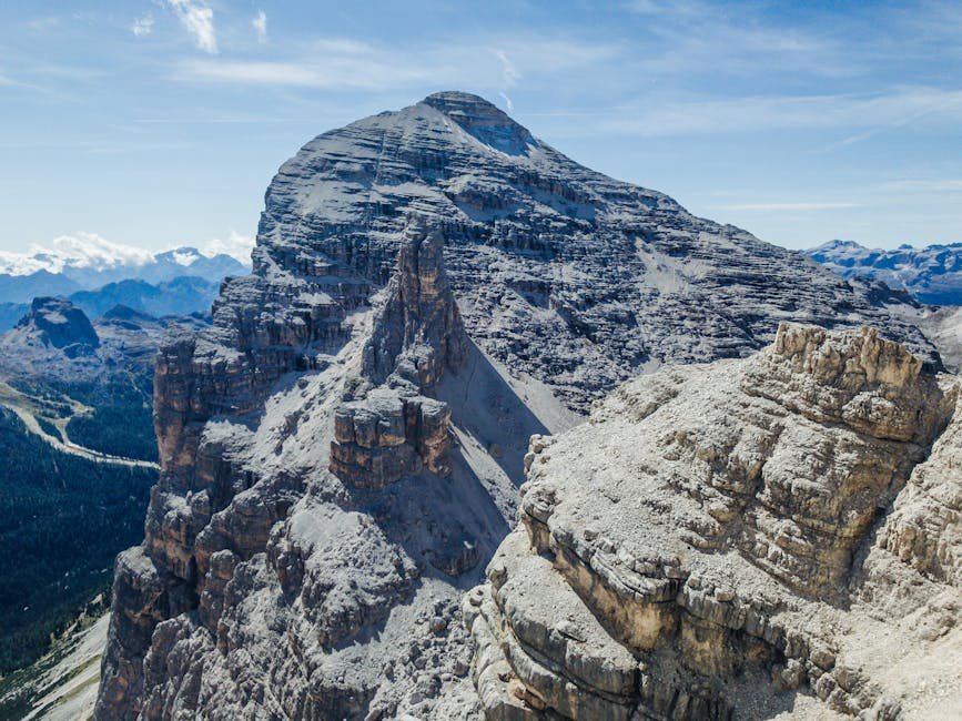 A stunning aerial view of the rocky Tofane peaks in the Dolomites, showcasing the rugged mountain landscape.