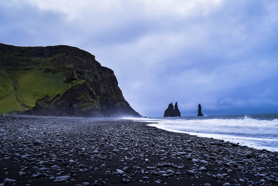 Discover the stunning beauty of Reynisfjara Beach with its iconic basalt sea stacks in Iceland.